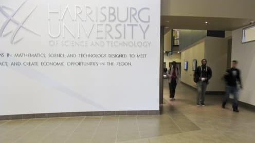 People walk through the atrium of Harrisburg University of Science...
