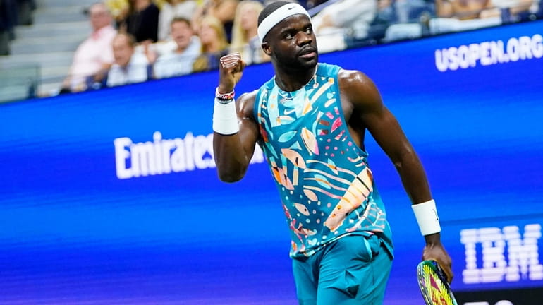Frances Tiafoe, of the United States, reacts after winning a...