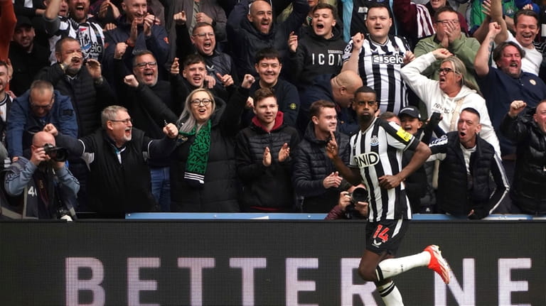Newcastle United's Alexander Isak celebrates after scoring his side's third...