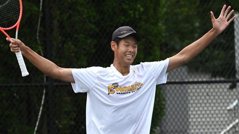 Edward Liao of Commack reacts after winning the singles title...