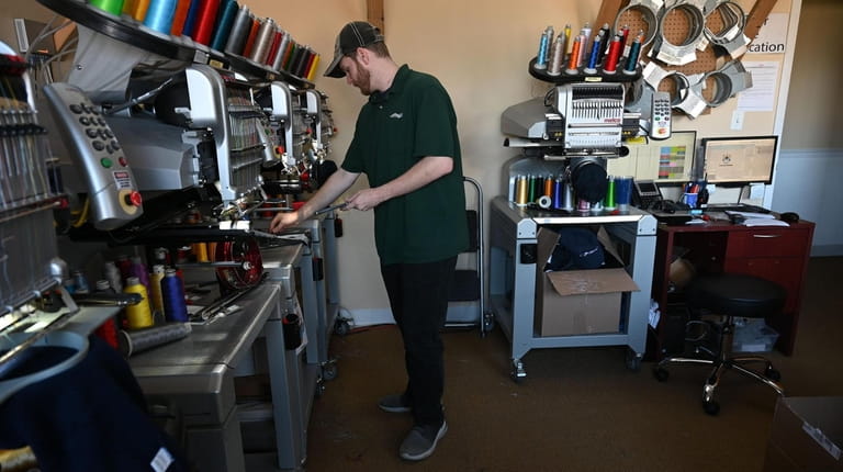 Brian Morrison, 31, of Manhasset, is an embroidery specialist at...