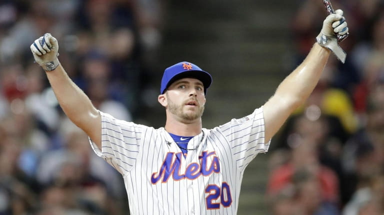 Mets first baseman Pete Alonso reacts after hitting during the first...
