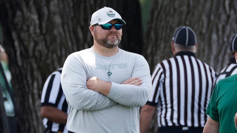 Joe Douglas, general manager of the Jets, watches practice at Atlantic...
