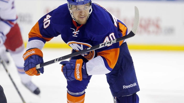 Michael Grabner of the Islanders skates against the Rangers at...