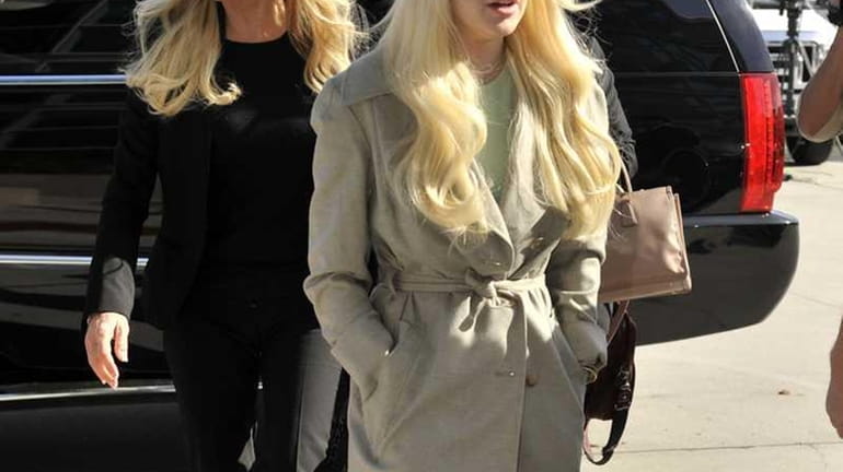 Lindsay Lohan arrives in court with her mother Dina in...