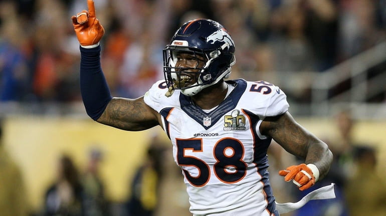 Von Miller of the Denver Broncos reacts after a play...