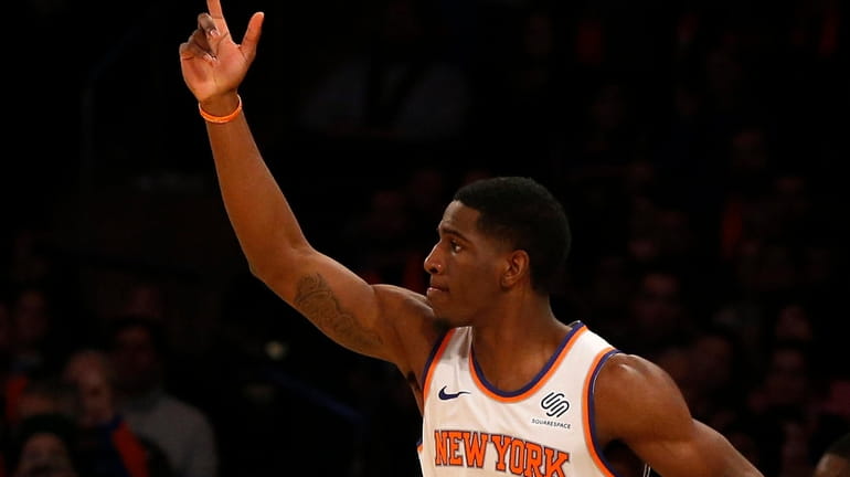 Damyean Dotson #21 of the New York Knicks reacts after...