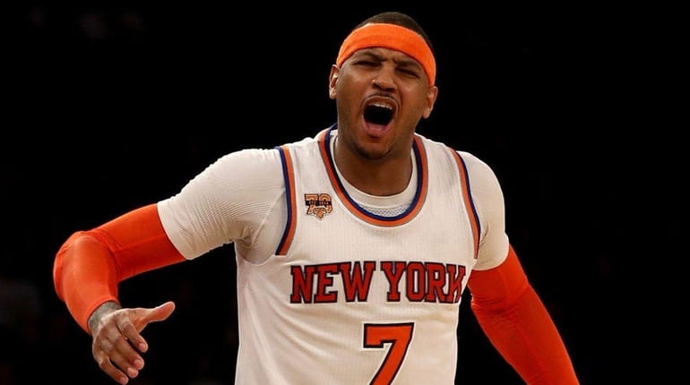 Carmelo Anthony of the New York Knicks reacts after he...