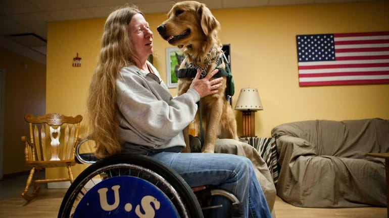 Jeanie Waters with her new assistance dog McGrew at East...