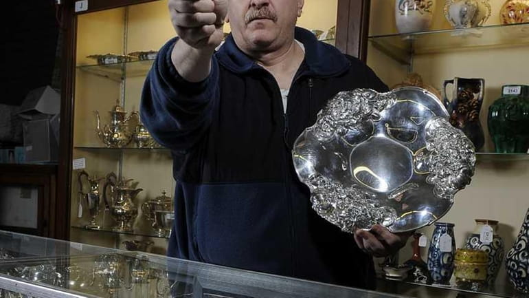 Phil Weiss, 54, auctioned this Gorham silver platter for $2,712....