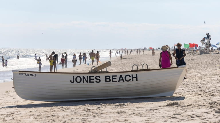 Beach goers hit the shores at Jones Beach on Wednesday,...