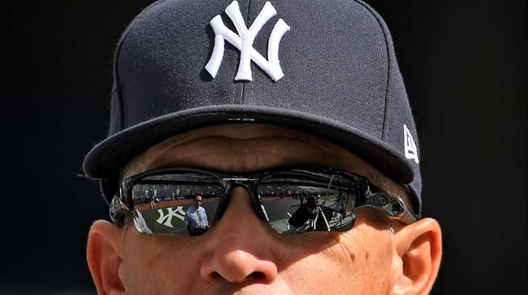 Yankee Stadium is reflected in the sunglasses of New York...