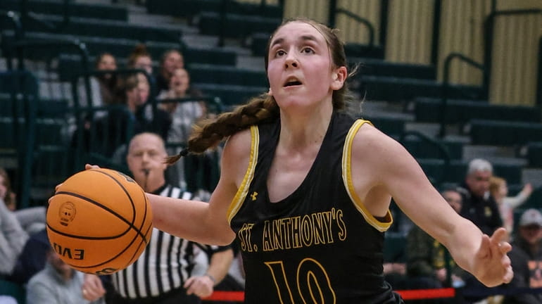 St. Anthony's Emma Toner looks to the basket during a...