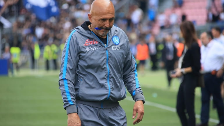 Napoli coach Luciano Spalletti walks off the pitch after the...