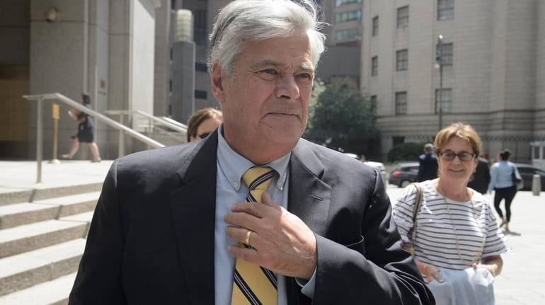 Dean Skelos leaves federal court in Manhattan during his retrial Wednesday.