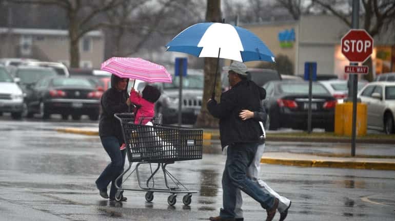 Shoppers walk to their cars in the Great South Bay...