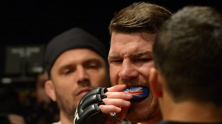 Michael Bisping gets ready to enter the cage for his...