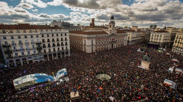 People gather in the main square of Madrid during a...