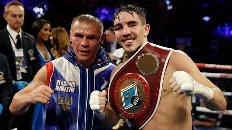 Ireland's Michael Conlan, right, poses with Russia's Vladimir Nikitin after...