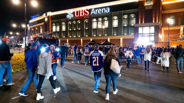 Fans arrive for the Islanders' first game at UBS Arena...