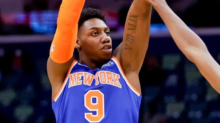 Knicks guard RJ Barrett shoots over Pelicans forward Herbert Jones in the...