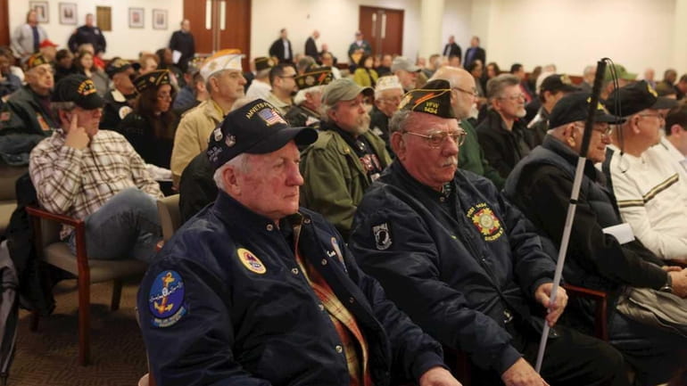 Veterans groups attend a session of the Nassau Legislature and...