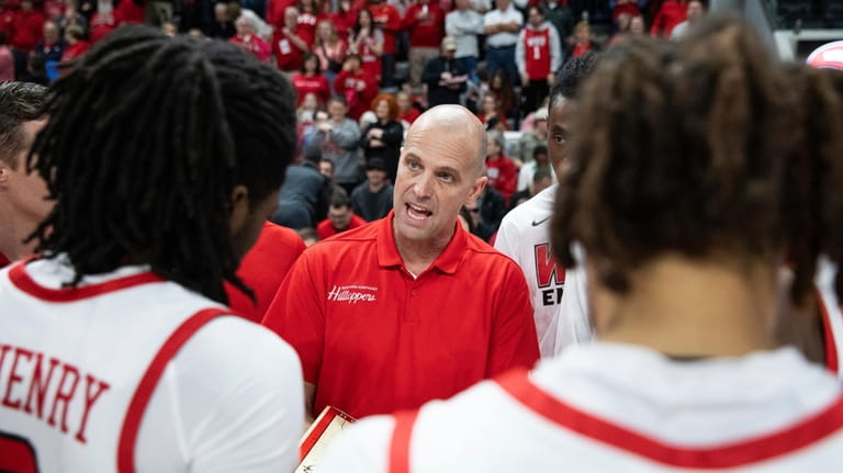 Western Kentucky Hilltoppers Head Basketball Coach Steve Lutz gives instructions...
