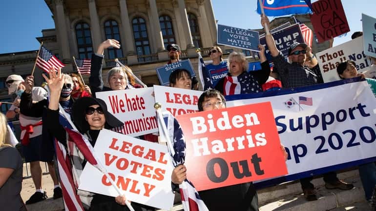 Demonstrators protest Joe Biden's presidential win at a "Stop the Steal"...