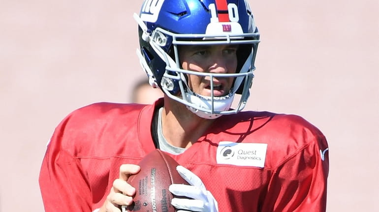 Giants quarterback Eli Manning looks to pass during training camp...