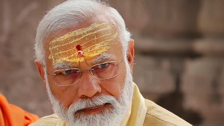 FILE- Indian Prime Minister Narendra Modi has sandalwood paste and...