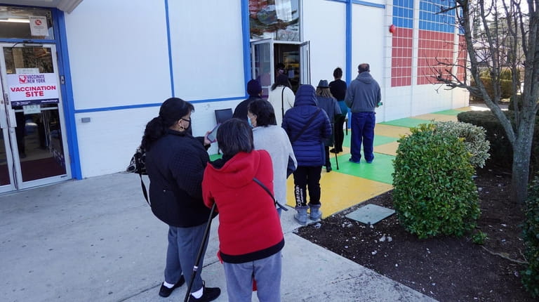 People line up to get a COVID-19 vaccine at La Espiguita...