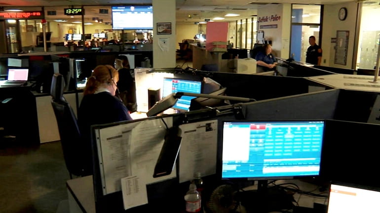 Suffolk County 911 operators work at police headquarters in Yaphank on...