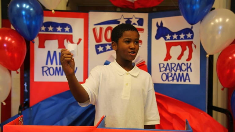Justin Martin, 11 in the 5th grade, casts his vote...