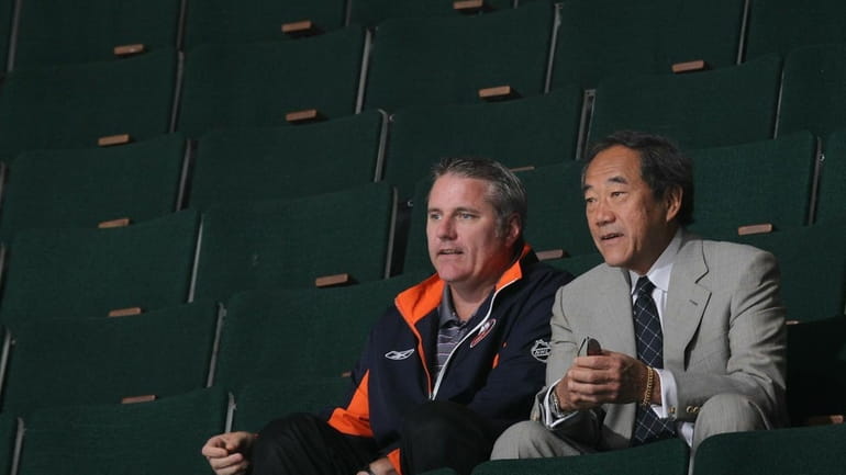 Islanders general manager Garth Snow and team owner Charles Wang...