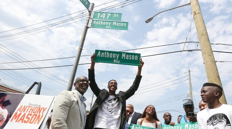 Anthony Mason, Jr.,and other family members at the street naming...