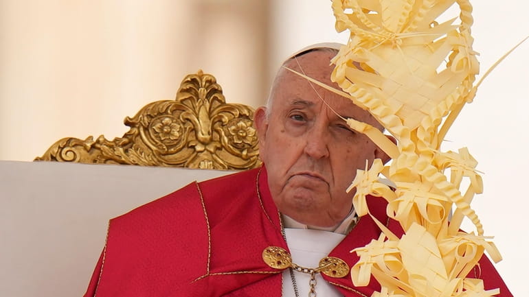 Pope Francis celebrates the Palm Sunday mass in St. Peter's...