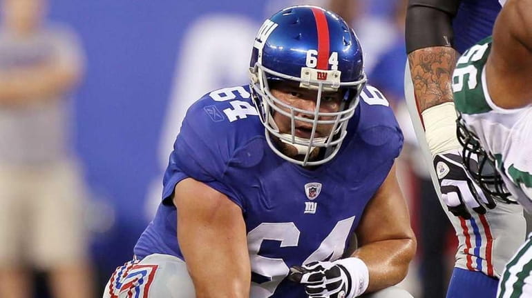 David Baas #64 of the New York Giants in action...