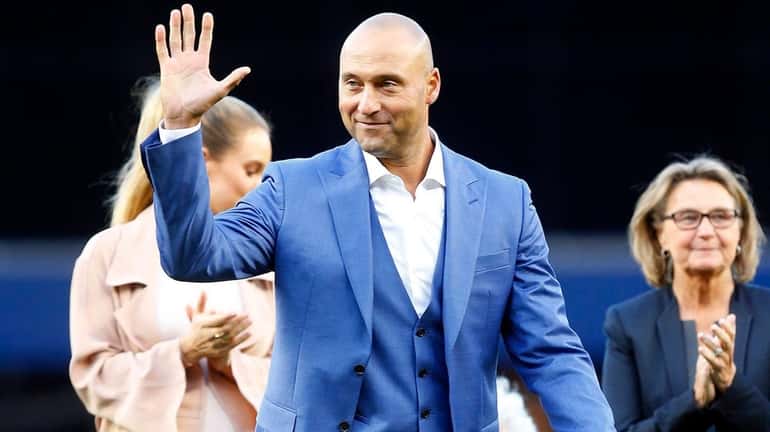 Derek Jeter waves to the fans during his number retirement...