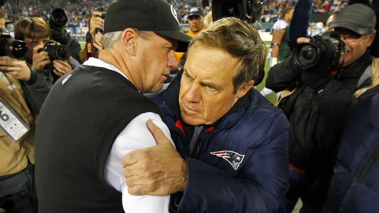 Jets head coach Rex Ryan hugs New England Patriots head...