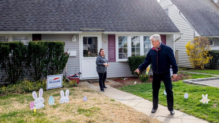 Republican State Senate candidate Chris McGrath canvasses door-to-door in East...