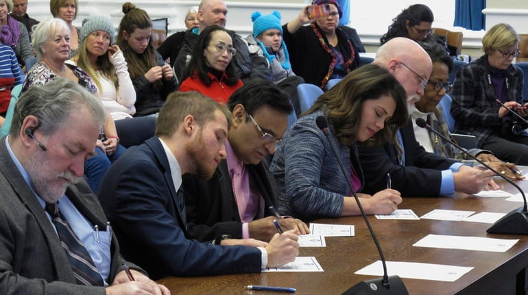 Nevada's six Democratic presidential electors sign their formal ballots for...