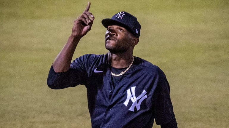 Yankees starting pitcher Domingo German reacts after pitching against the Tigers in...