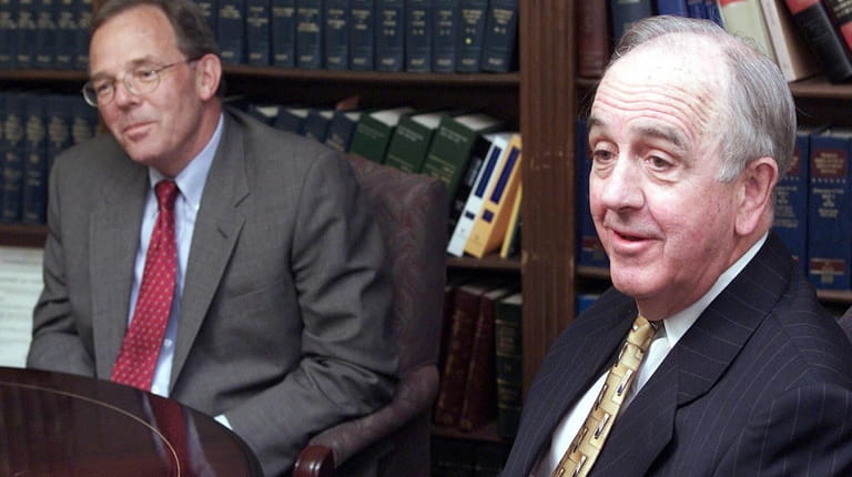 John Klein, right, in April 2003, announces that then-Suffolk County Executive Robert...