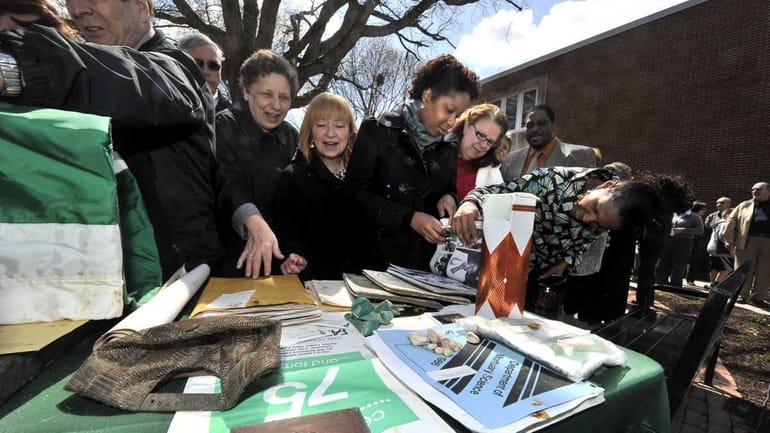 People celebrate Farmingdale State College's 100th anniversary and view the...