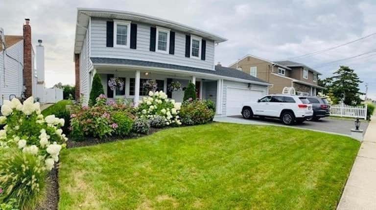 Priced at $1.093 million, this four-bedroom, 2½-bath Colonial has solar panels...