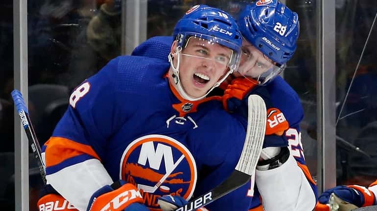 Anthony Beauvillier of the Islanders celebrates his overtime goal against...