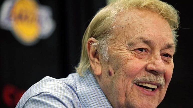 Los Angeles Lakers owner Jerry Buss smiles during an news...