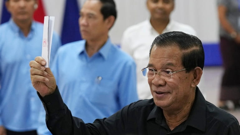 Cambodian former Prime Minister Hun Sen, foreground, of ruling Cambodian...