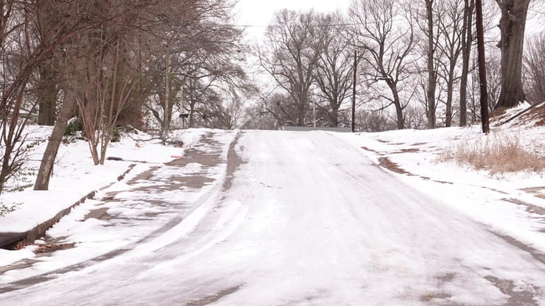 Many roads remained slick and full of ice Monday, Jan....
