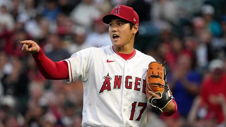 Los Angeles Angels starting pitcher Shohei Ohtani gestures to a...